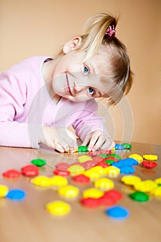 Small girl with toy mosaic