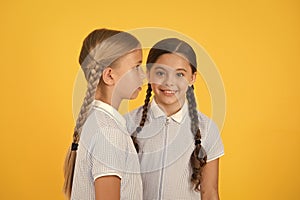 Small girls in retro uniform. old school fashion. back to school. happy beauty with pigtails. happy childhood. brunette