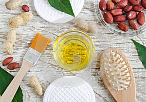 Small glass bowl with peanut groundnut oil for preparing face and hair mask. Natural skin and hair mask recipe.