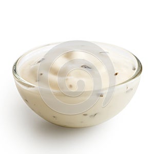 Small glass condiment bowl of white garlic and herb sauce. Isol photo