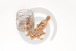 Small glass jar full of green lentil