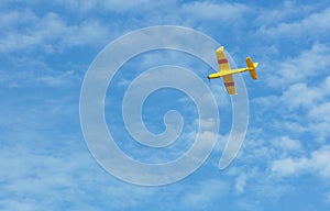 Small glider airplane flying high