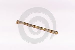 Small gold black metal hairpin isolated on white background closeup