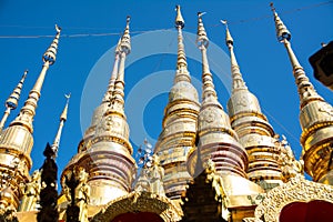 small golden pagoda in Wat Phra That Suthon Mongkhon Khiri, Phrae province, northern of Thailand