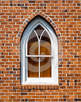 Small Gothic Window in Red Brick Wall