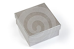 Small gray square cardboard box with closed lid