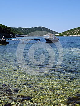 Small Greek Boat Moored in Bay