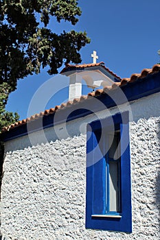 Small greek church between cypresses