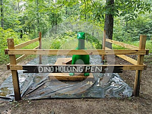 Small green dinosaur in holden pen