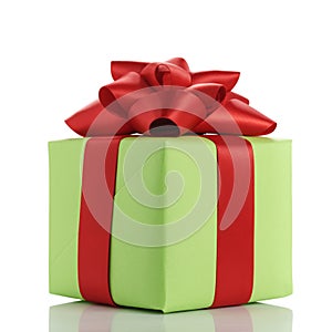 Small green gift box with red ribbon bow isolated on white