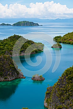 Small green Islands belonging to Fam Island in the