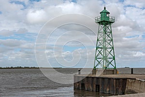 Small green lighthouse at the mouth of the Geeste River in the North Sea, Bremerhaven