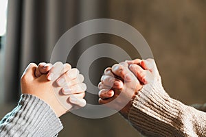 Small group of asian people praying worship believe. Teams of friends worship together before studying Holy bible. family praying