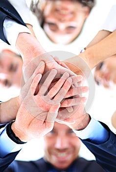 Small group of business people joining hands