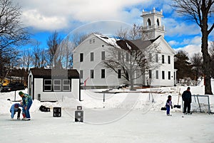 Ice skating on a frozen pond in New England