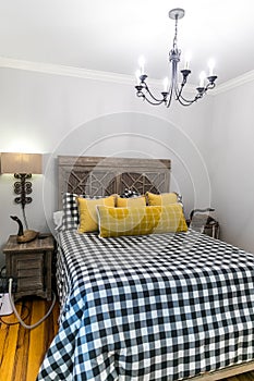 Small guest room with an intricate wood bed