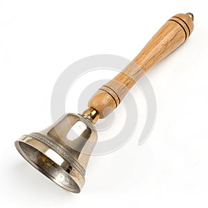 Small handbell with wooden handle isolated on white background photo