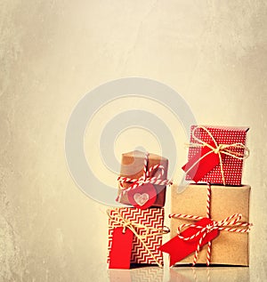 Small handmade gift boxes on pastel background