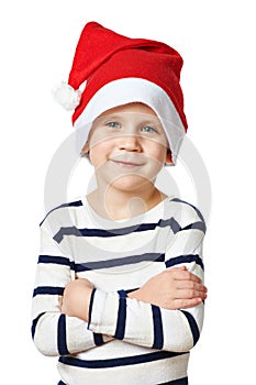Small handsome boy in red Santa hat isolated