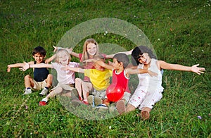 Small happy little group of children outdoor