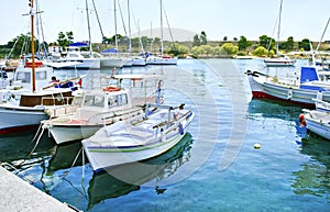 Small harbor with boats in Aegean island Greece