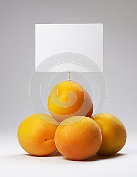 Small heap of apricots with signboard