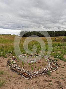 A small Heart shaped structure build by travelling Visitors behind the dunes at Montrose Beach.