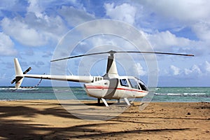 Small helicopter for excursions on a deserted beach photo