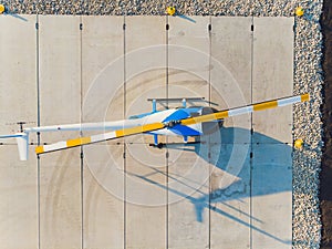 a small helicopter takes off from the field in the city.