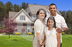 Small Hispanic Family in Front of Their Home