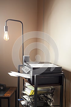 Small home office or cubical with a floor lamp