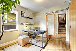 Small home office interior with hardwood floor. View of staircase. photo