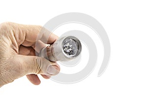 Small home pocket led flashlight in hand on the white.
