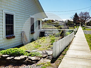 Small home with white picket fence