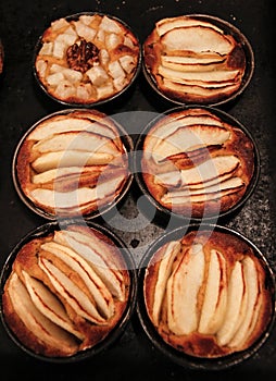 Small homemade apple pies freshly baked each in its mold