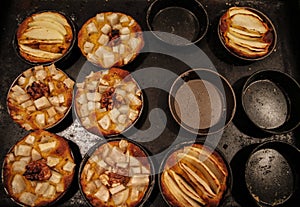 Small homemade apple pies freshly baked each in its mold