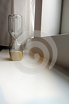 Small Hourglass on Windowsill with Space for Copy