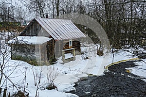 Small house on the banks of an unfinished river