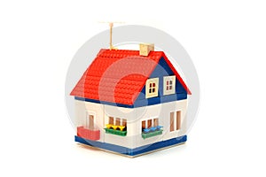 Small house constructed of toy blocks photo