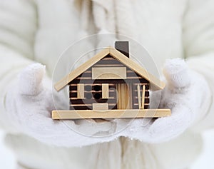 Small house in hands of a child