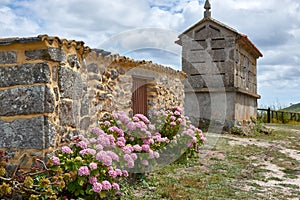 Small house with its horreo on the Island of Ons in Galicia, Spain photo