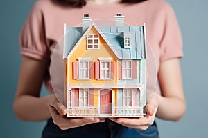 Small house model in human hands, mortgage and home protection concept, AI Generated