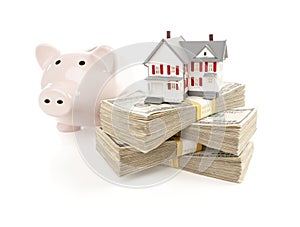 Small House and Piggy Bank with Stacks Money