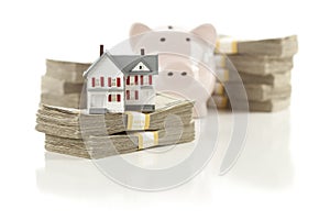 Small House and Piggy Bank with Stacks Money