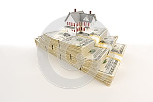 Small House on Stacks of Hundred Dollar Bills