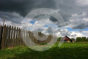 Small house and the storm sky