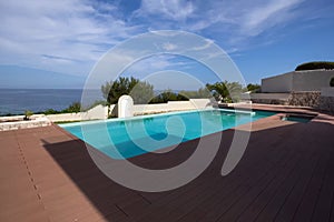 small house with a swimming pool on the shores of the Mediterran