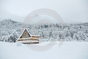 small house in winter camping in mountains. Small village in mountains of Western Caucasus. Christmas mood