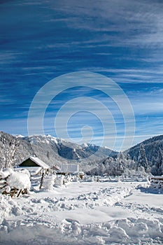 small house in winter camping in mountains. Small village in mountains of Western Caucasus. Christmas mood