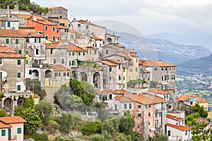 Small houses chaotically standing on the hill in Italy